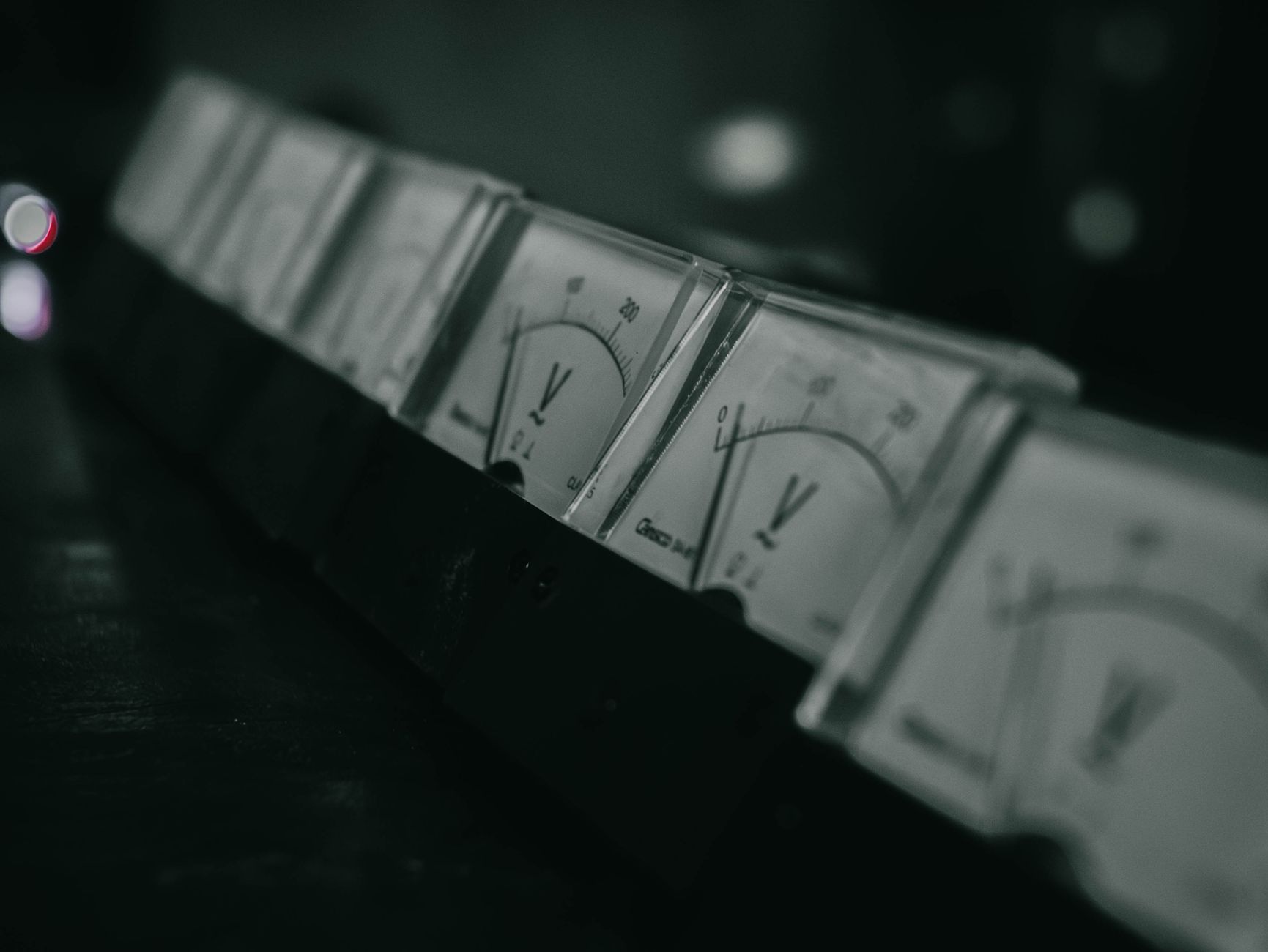 vintage analog voltage meters in industrial setting